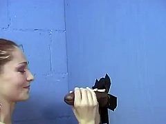 A playful White girl with long hair takes off her clothes in a gloryhole room. Sally gives a blowjob to a guy with a big fat cock.