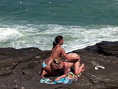 Beautiful girls Tarra White and Aneta Keys are getting naughty on a rocky shore. The lesbians lick and finger each other's pussies and enjoy it a lot.