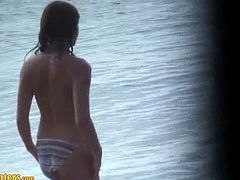 A beach hunter spots two girls that he films with his hidden cam. They are both sexy, with small tits and juicy asses. They are on the beach, walking and swimming.