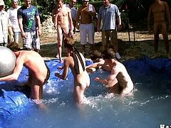 Blindfolded guys play some sort of game in public. After the game these dudes start to suck each others big cocks in water.