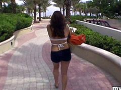 A horny brunette girl flashes her boobs on a beach in a reality video. This playful girl also gives a handjob to a guy in POV style clip.