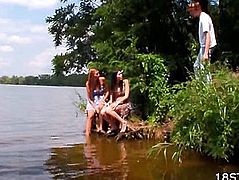 Girls watching a guy in the river