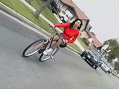 Press play to watch this brunette babe, with a nice ass wearing a miniskirt, while she rides her bike and suddenly gets really horny.
