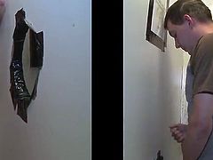 A kinky blond poofter is having a good time indoors. He finds a cock sticking out of a gloryhole and sucks it as best as he can.-