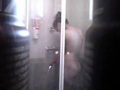 hot, young girl takes a shower