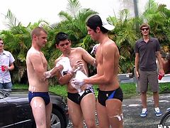 Gay men in an orgy smashes each other in foam from washing a car then proceed to give each other a hand job before having an anal hardcore sex