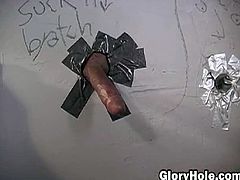 Amber Wild grabs the first black cock that appears through the glory hole and puts it in her mouth to suck it. She doesn't know who is behind the wall and she doesn't care.