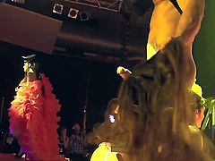 Two hot sluts feeling horny and wishing for a good fuck wake up a sleeping man-whore, having a lot of fun fucking and sucking each other in a threesome action in a noisy club.