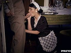 Stunning brunette girl looks hot and sexy wearing maid's uniform. She is seduced by the land lord while his wife is out. Sexy girl sucks juicy cock like tasty lollipop.