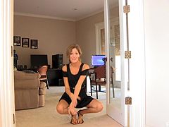 Click to watch this blonde babe, with natural boobs wearing a cute dress, while she moves in an erotic way around her glamorous house.