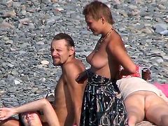 Horny voyeur must feel amazing watching such beauties exposing their nude forms at the beach