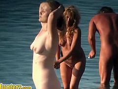 The nudist beaches are a great place for voyeurs to record people. On this beach there are many sexy chicks who walk around naked and carefree in and out of the water.