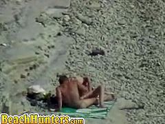 Watch these voyeur shots of lovely couples making out and getting naked at the beach. Some are chilling out while others are doing naughty things like giving head.