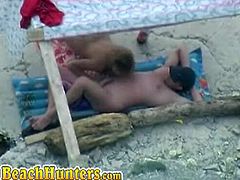 Nude lovers at the beach doing naughty things