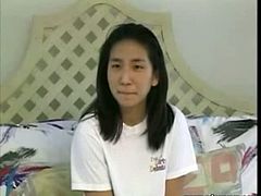 Innocent looking teen asian and smooth skinned redhead started kissing and groping each other opening up for a possibility of hot steamy interracial lesbian sex.