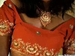 Bollywood Nudes brings you a hell of a free porn video where you can see how this alluring Indian brunette strips and teases while assuming some very naughty poses.