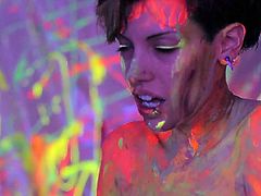 Lewd short haired chick Jinxy Laroue plays with her goodies covered in sticky fluorescent paint. Feel free to jerk off on Jinxy's jiggy shiny tits.