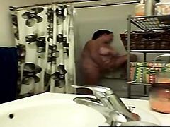 Spying sexy busty milf in the shower