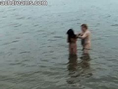 This swinger couple are playing in the water after a wild orgy. They are both still horny and she shows pretty amazing acrobatic skills to reveal her tight snatch.