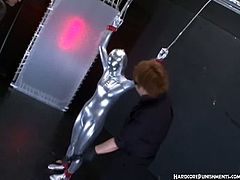 Helpless asian chick is full body wrapped with a weird silversuit and got exploited by her three horny masters played her nipples and her pussy with extreme vibrators