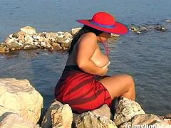 Aneta Buena loves to flaunt her body specially her big tits outdoor. She is in the beach to show not just skin but some titties.