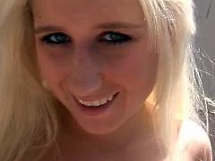 Lusty blonde takes off her bra and gives outdoor blowjob