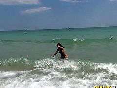 This sexy chick is walking up and down the beach when she is approached by a hunk who is flashing a big wad of cash. He'll give her some money if she shows off her skimpy bathing suit. She strips down to just her tiny bikini and takes a dip in the ocean.