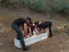 The explorers find Snow White in the middle of a field in a coffin, and they see an opportunity to have dirty sex with her. They wake her up and make her suck on those stiff cocks. They hold her by her wrists.