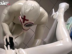 Fiona puts on a very kinky latex and lets her slave fuck her with a huge dildo.