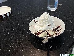 This beautiful young teen is in the kitchen make up a sweet snack. She takes two big scoops of ice cream and puts it into a bowl. The dirty slut covers the tasty dessert with whipped cream and chocolate sauce. Watch as the cutie gets whipped cream all over her perky boobs. Her man licks off the confection from her tits.
