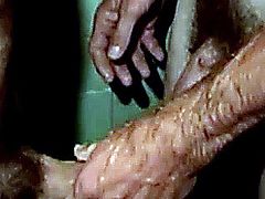 Gay amateurs jerking each other off in the shower in close up view