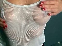 Dakota looks good wet! Watch as this beauty pours water all over her thin white tank top so you can see her perfect tits.
