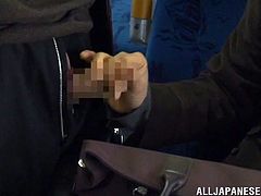 This sexy clerk is coming home from the office on the bus. A man is standing beside her and she accidentally, brushes her hand up against his crotch. Before long his dick is out of his pants hole and she is giving him a public handjob.