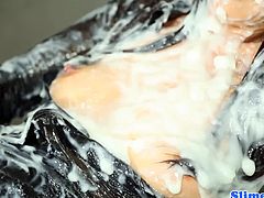 Marcia Hase is a classy Asian chick. She gets a shower of cum from a cock that appears trough a glory hole. She is literally covered in thick, sticky sperm.
