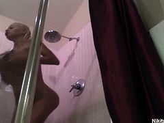 Nikita Von James is now in the shower and film herself again teasingly soaping her luscious body and her firm huge titties and posing in front of the cam caressing her pussy.