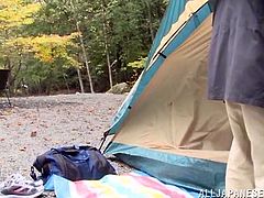 The brunette Japanese in the video, adores posing in indecent sexy position for her horny lover. After the photo session in the woods, the couple retreats in the tent. The sexy slut enjoys sucking her partner's cock, while outdoor. The images are an eloquent proof. Don't miss the kinky details!