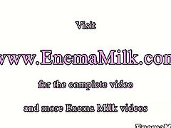 Milk enema lover squirting over her lesbian gf.