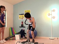 Sporty Japanese slut Ria Horisaki gives hand to a guy in a gym