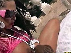 This brunette chick is busty and she teases outdoors with her tanned pussy and ass. She sits on a butt plug and then she inserts a black dildo inside her cunt.