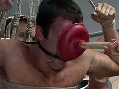 This guy is bound with rope and suspended from the ceiling. Countless studs shove their dicks in his butt hole and fuck him for as long as they want. He occasionally gets a blowjob and a handjob.