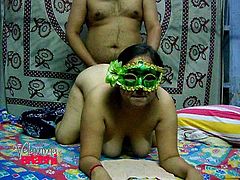 This chubby Indian whore is super horny! She's not afraid to show off her big tits and ass, but she keeps her face hidden. She gives him head and then, bends over in front of him, to take his hard cock from behind.