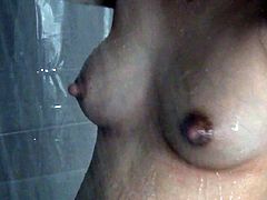 Post pregnancy engorged breast feeding wife taking a shower