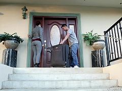 A young couple just arrived to the big mansion and got a nice room with a large bed in the villa. It is a 