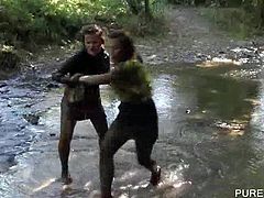 Two horny lesbian lovers getting wet clothed in the river