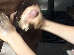 Lucky dude gets a handjob from a brunette