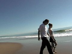 A couple walks on the beach then ends up on the ground fucking