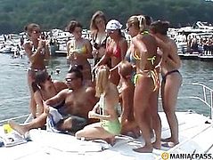 The girls are standing on a boat