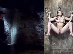 Some bitches fantasies can get really rough. It's also the case of sexy Dahlia, who got tied up by a fierce executor, who keeps her prisoner of a creative strong rope bondage. Click to see the mouth gagged blonde-haired slut, getting aroused with the help of sex toys, such as vibrator and dildo.