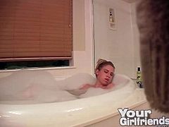 Masturbating blonde in the bubble bath cums