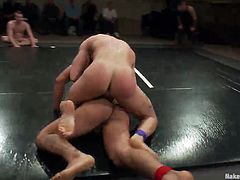 naked men wrestle on the arena